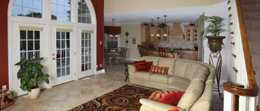 view of great room from foyer - living room, kitchen, and dining room, and stairs to second floor