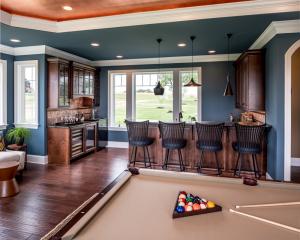 billiard room with built-in wet bar and small kitchen