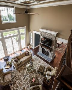 aerial view of living room with stone fireplace