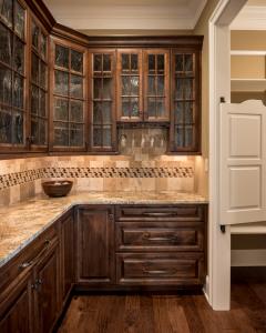 kitchen with wood and glass upper cabinets