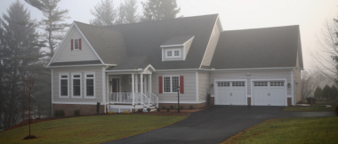 cream colored two-story house with attached garage