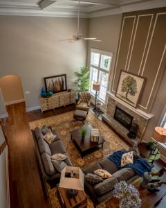 aerial view of living room with stone fireplace