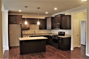 kitchen with brown cabinets and island
