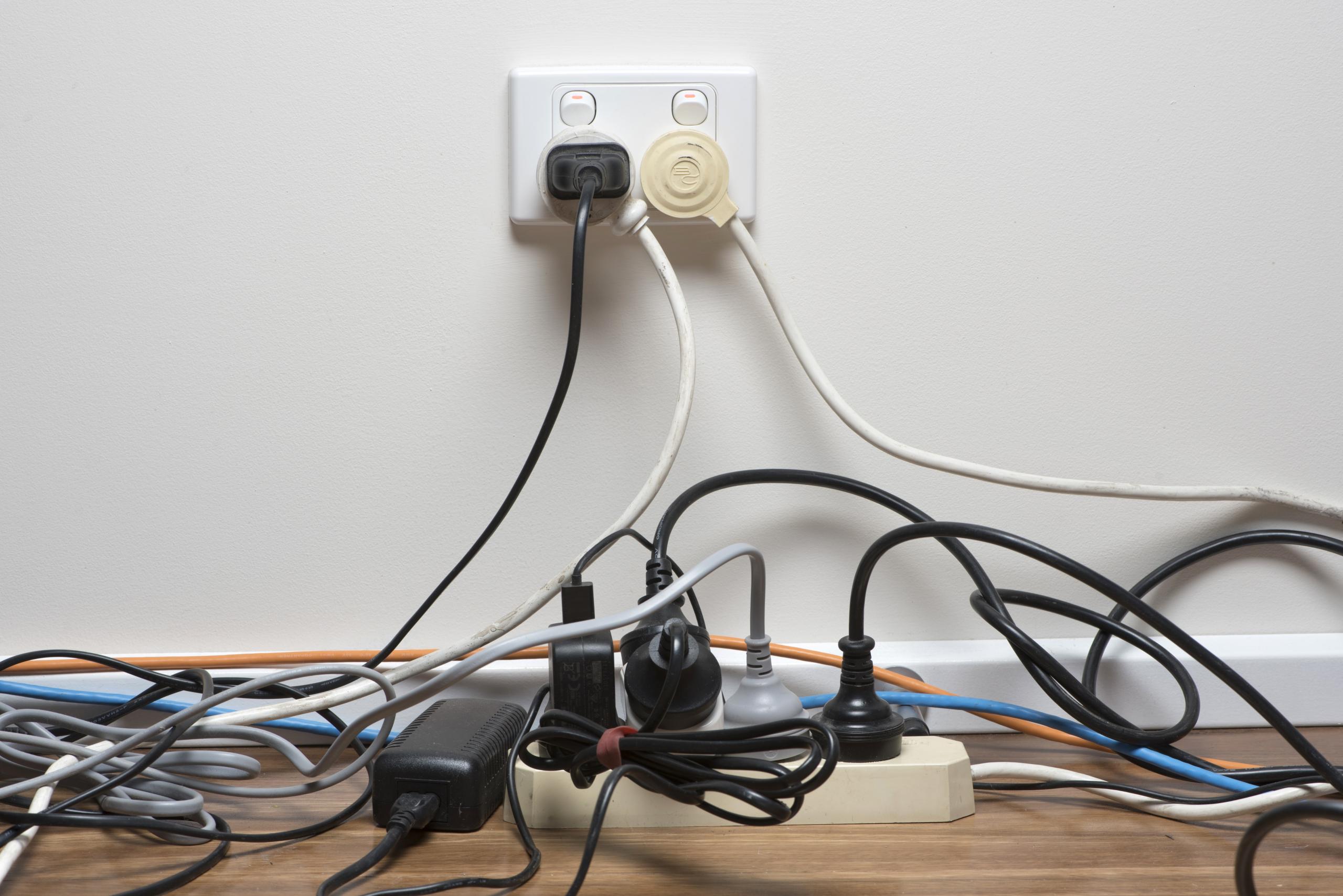 https://www.customhomegroup.com/wp-content/uploads/2020/01/electrical-hazards-outlet-overloaded-with-multiple-power-strips-scaled.jpg