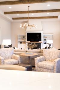 living room with built-in entertainment center and fireplace