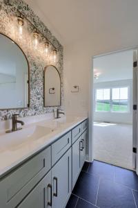 bathroom vanity with wallpaper accent