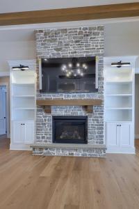 fireplace with built-in screen and shelves
