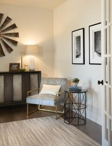 corner of study featuring a chair and side tables