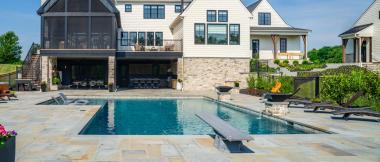 custom home backyard with pool and diving board