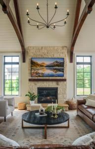 fireplace and chandelier in great room