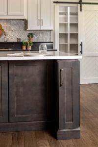 detail of narrow cabinets built into kitchen island