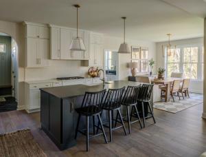 kitchen with island with seating and dining room