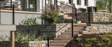 multi-level patios and decks with landscaping and garden beds