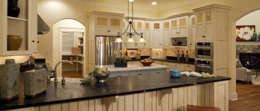 kitchen with island, recessed lighting, and mixed glass-front cabinets